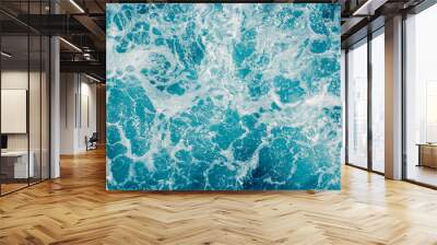 Pale blue green sea surface with waves and foam, abstract background Wall mural