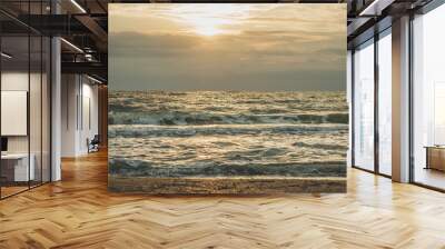 Wonderful landscape with the sea and its waves at sunrise. Autumn at sea. Wall mural