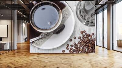 coffee cup and coffee beans on white wooden table Wall mural