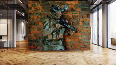 Man in uniform with machine gun and night-vision device stand beside broken wall. Airsoft soldier in night building Wall mural