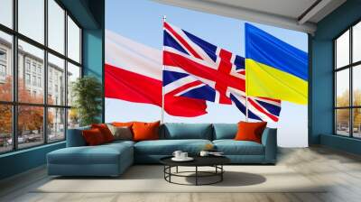 Three flags of countries of Europe on flagpole. Flag of Ukraine, Poland and Great Britain. State symbols. Flags fluttering in wind. 3D illustration. Wall mural