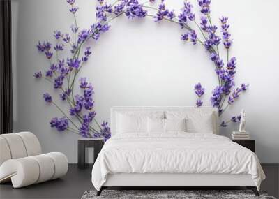 A circular arrangement of lavender flowers on a white background, showcasing natural beauty. Wall mural