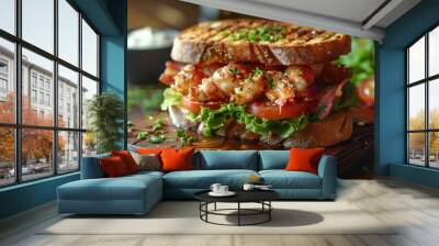 A delicious sandwich with shrimp, lettuce, tomatoes, and grilled bread, served on a wooden board. Wall mural