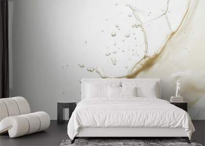 A splash of liquid creating dynamic droplets against a light background. Wall mural