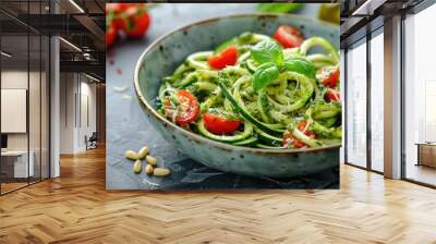 A vibrant bowl of zucchini noodles topped with cherry tomatoes, basil, and pesto. Wall mural