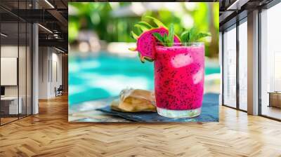 A vibrant pink dragon fruit smoothie garnished with mint, set against a tropical pool backdrop. Wall mural