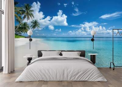 Serene tropical beach with clear water, palm trees, and vibrant blue sky. Wall mural