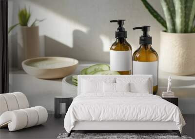 Two amber bottles with blank labels beside sliced cucumbers on a light countertop. Wall mural