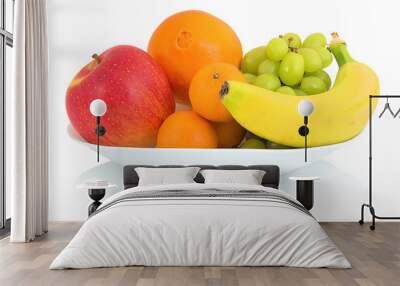 Bowl of fresh fruits isolated on white background with shadow reflection. Apple orange mandarin grape and banana in white bowl. Wall mural