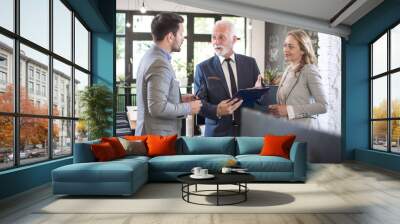 Business partners having conversation in office Wall mural