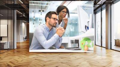 Concentrated Business colleagues looking together at computer screen in office Wall mural