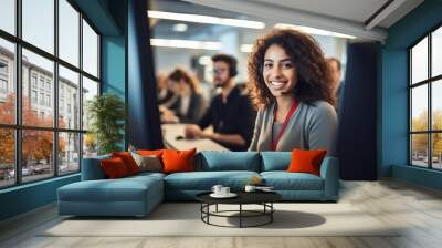 Diligent female call center agent, focused and dedicated, managing tasks on a computer within the central customer service hub. Wall mural