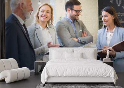 Group of mixed aged business people in elegant formal suits planning business strategy at office Wall mural