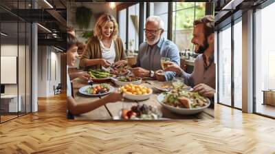 Multi generation family eating meal around kitchen table. Wall mural