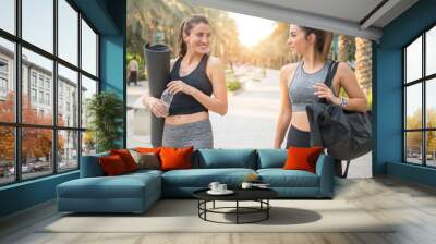 Sporty women going for fitness workout in the park. Wall mural