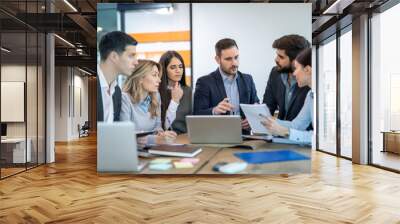 Team of focused business executives analyzing company annual financial report balance together at office. Business, market, office and tax concept. Wall mural