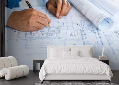 Architect s Hands Drawing Blueprints for Construction Project Wall mural