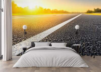 Asphalt Road with White Line and Sunset Wall mural