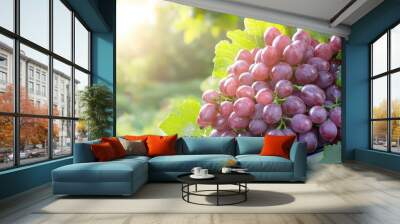 Fresh Red Grapes on Vine with Green Leaves and Sunlight Wall mural