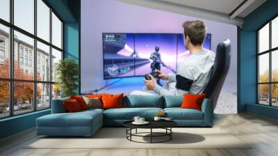 Gamer Playing Video Games on a Large Screen. Wall mural