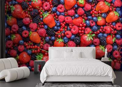 Berries overhead closeup colorful large assorted mix of strawbwerry, blueberry, raspberry, blackberry, red curant in studio on dark background Wall mural