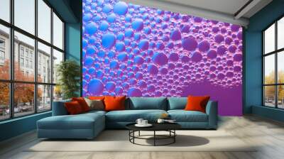 Abstract background of bubbles on water surface with a gradient from violet to blue Wall mural