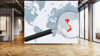 World map with a magnifying glass pointing at Vietnam. Map of Vietnam with the flag in the loop. Wall mural