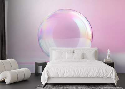 A Single Transparent Sphere on a Soft Pink Background Wall mural