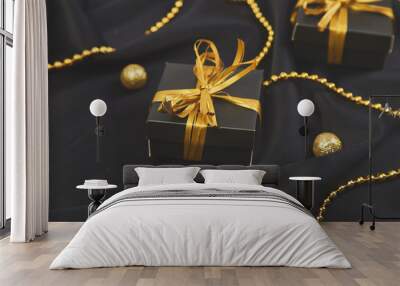 Luxury black gift boxes with gold ribbon Wall mural