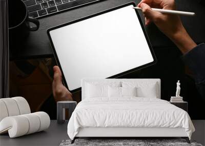 A man using digital tablet touchpad at his modern office desk. Wall mural