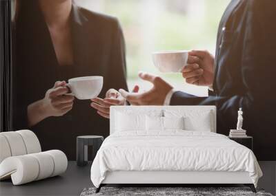 Business team discussing while having coffee break Wall mural