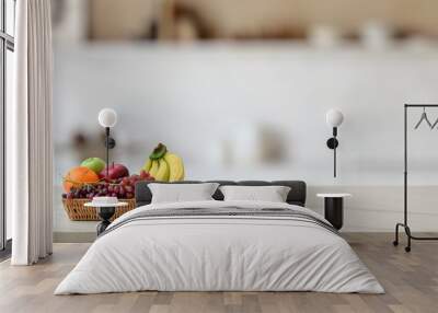 Close up view of fruit basket on marble desk with blurred kitchen room Wall mural