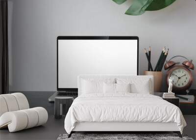 Close-up view of open blank screen laptop computer with office supplies in modern office Wall mural