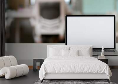 Close up view of simple office desk with blank screen laptop and copy space Wall mural