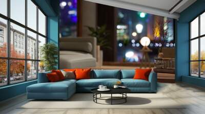 Copy space on wood coffee table in modern contemporary apartment living room at night Wall mural