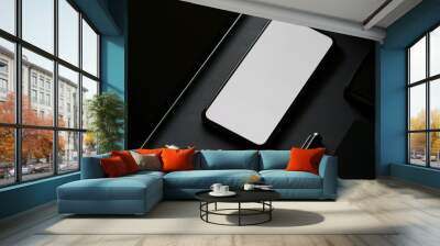 Cropped shot of blank screen smartphone in dark modern office Wall mural