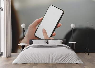 Cropped shot of businesswoman using blank screen smartphone Wall mural