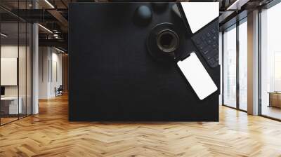 Dark modern workplace with tablet and office supplies on black leather background Wall mural