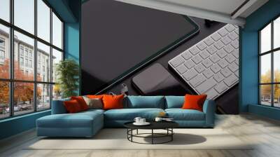 Digital devices with tablet, smartphone, keyboard and accessories on workspace Wall mural