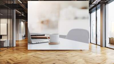 Modern workplace with laptop computer, coffee cup and office supplies Wall mural