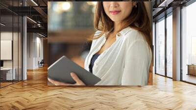 Portrait of Beautiful professional businesswoman holding touchpad Wall mural