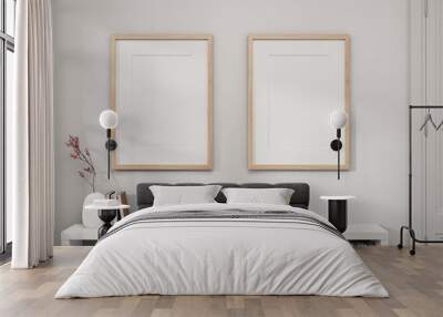 Two picture frames mockup on a white wall and a white bookcase in a white minimal room. Wall mural