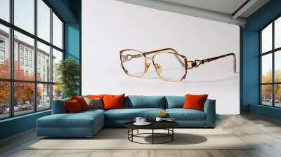 Gold-rimmed glasses. Copy space for your text Wall mural