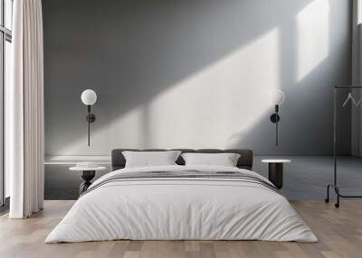 A minimalist blank wall with soft light and a concrete floor. Ideal for product placement or as a background. Wall mural