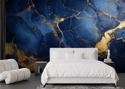 Dark blue stone background texture featuring golden paint splashes Wall mural