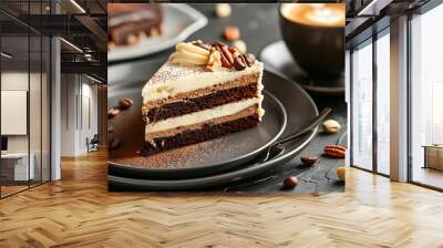 chocolate cream cake with nuts on a plate and a cup of cappuccino coffe on a black table Wall mural