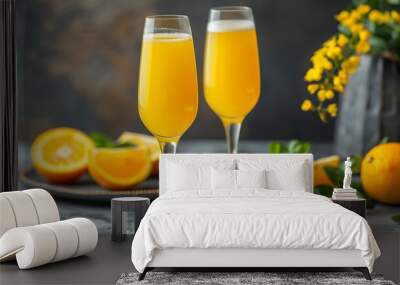 Two glasses of mimosa cocktail champagne with orange juice easter decoration Wall mural