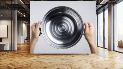 Hand holding stainless steel pan or wide pot Wall mural