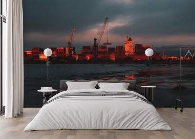 container cargo freight ship at sunset Wall mural