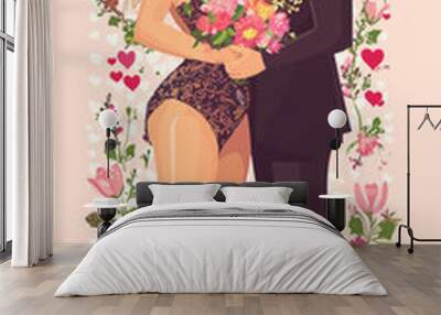 A man and woman are kissing in front of a flower arrangement. The man is wearing a suit and the woman is wearing a dress Wall mural